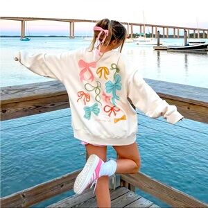 “ and she will bow to no one “ bow crewneck